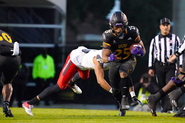 Nov 26, 2021; Greenville, North Carolina, USA; East Carolina Pirates running back Keaton Mitchell (25) runs with the ball during the first half against the Cincinnati Bearcats at Dowdy-Ficklen Stadium. Mandatory Credit: James Guillory-USA TODAY Sports